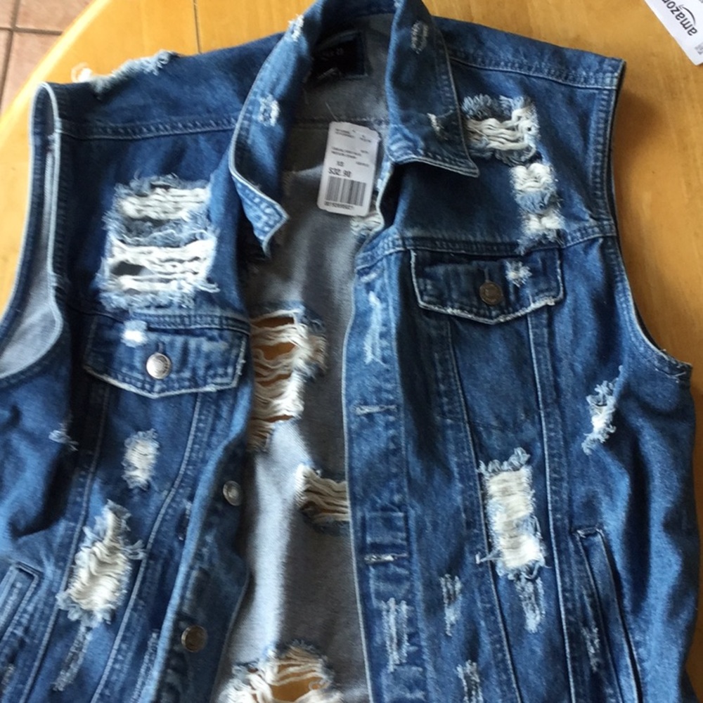 Ripped Blue Jean Vest.